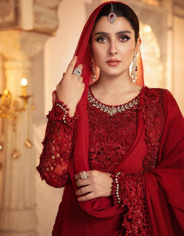 Ayeza Khan looks glamorous in a vibrant red dress.