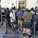 UK: Non-Essential Items Shops Open As People Rush Long Queu in London After Lockdown