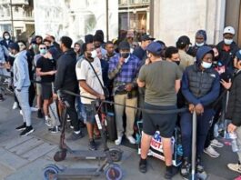 UK: Non-Essential Items Shops Open As People Rush Long Queu in London After Lockdown