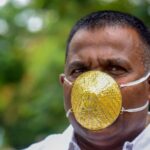 Indian man wears gold face mask to avoid coronavirus Indian man wears gold face mask to avoid coronavirus