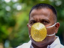 Indian man wears gold face mask to avoid coronavirus Indian man wears gold face mask to avoid coronavirus